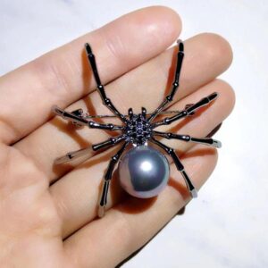 This silver spider is fashionably dramatic!